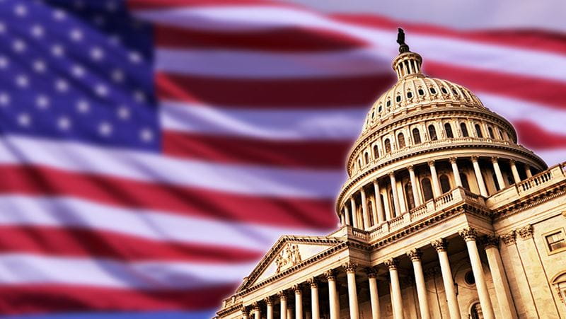 U.S. Capitol with flag in the background